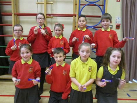 Winners of the KS2 Internet Safety Poster Competition pictured with their new memory sticks and a chocolate treat!